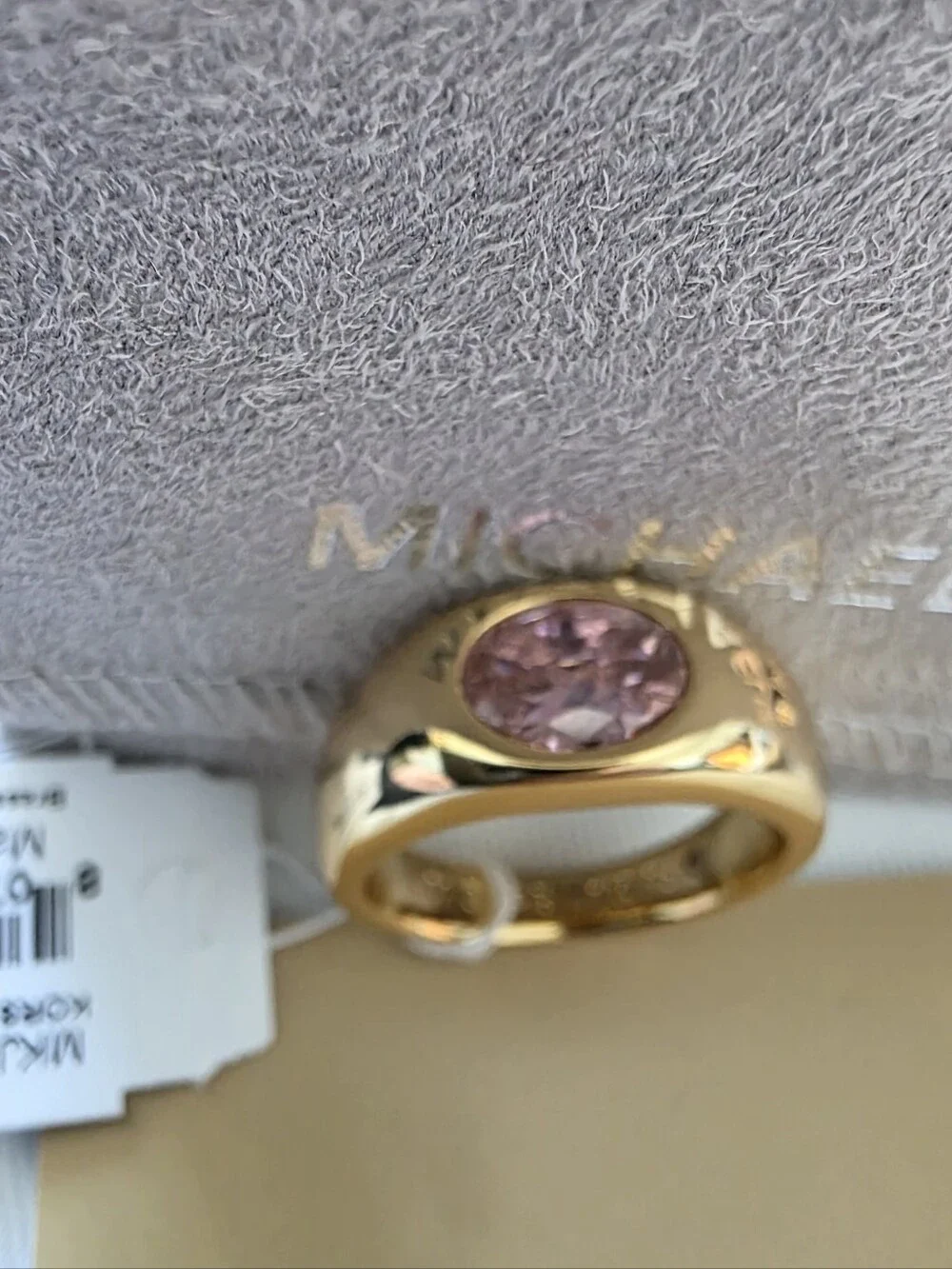Michael Kors Gold Tone Band Ring with Pink Faceted Stone
